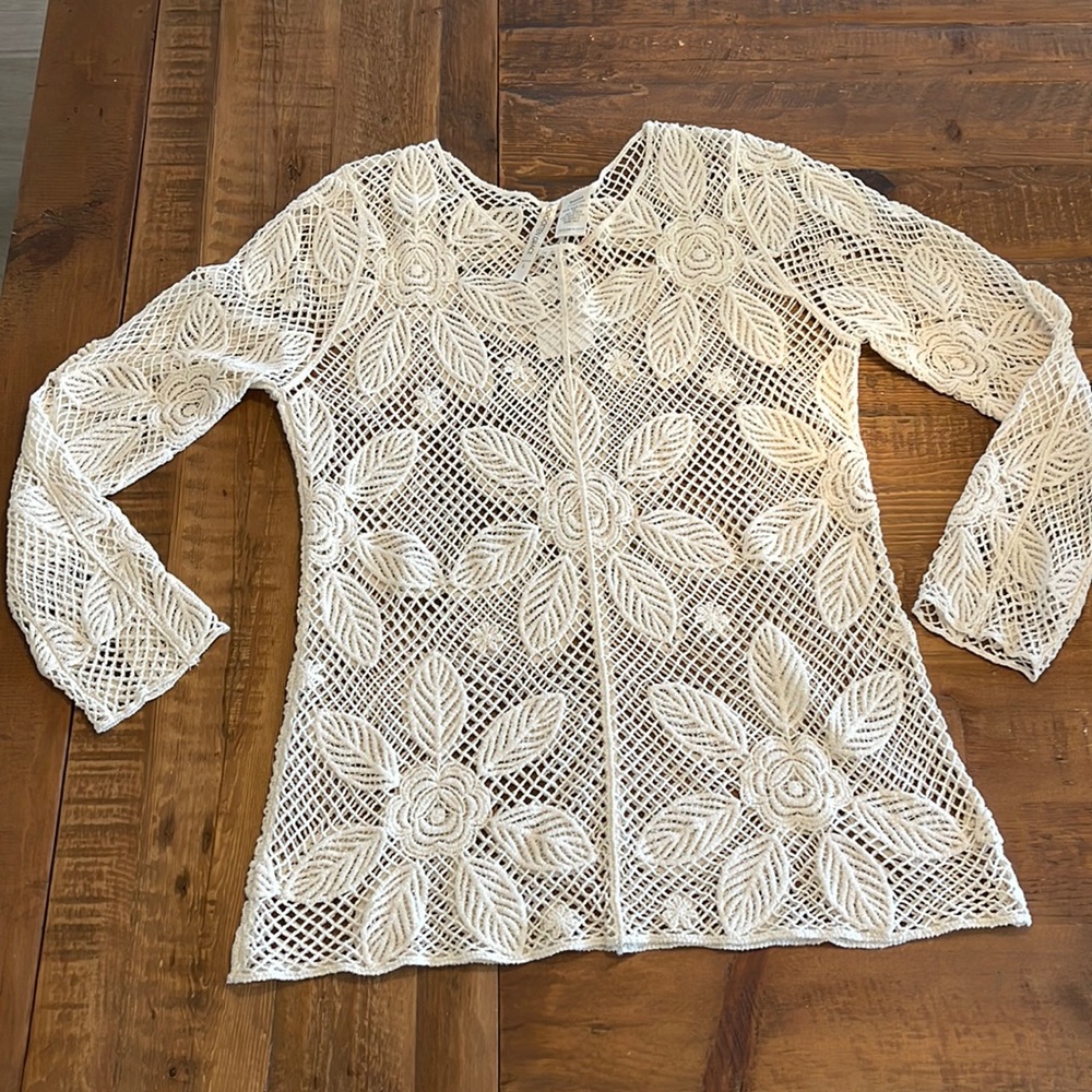 Never worn. Crochet long sleeve blouse.